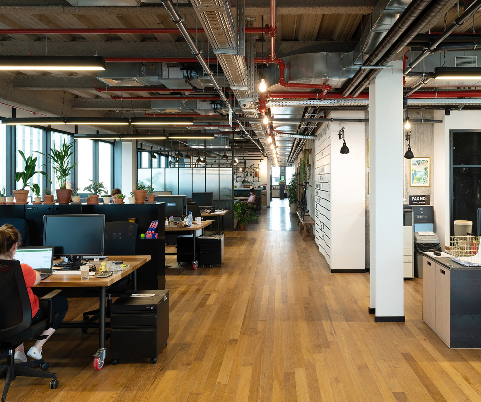 Contemporary shared workspace with desks and collaborative seating