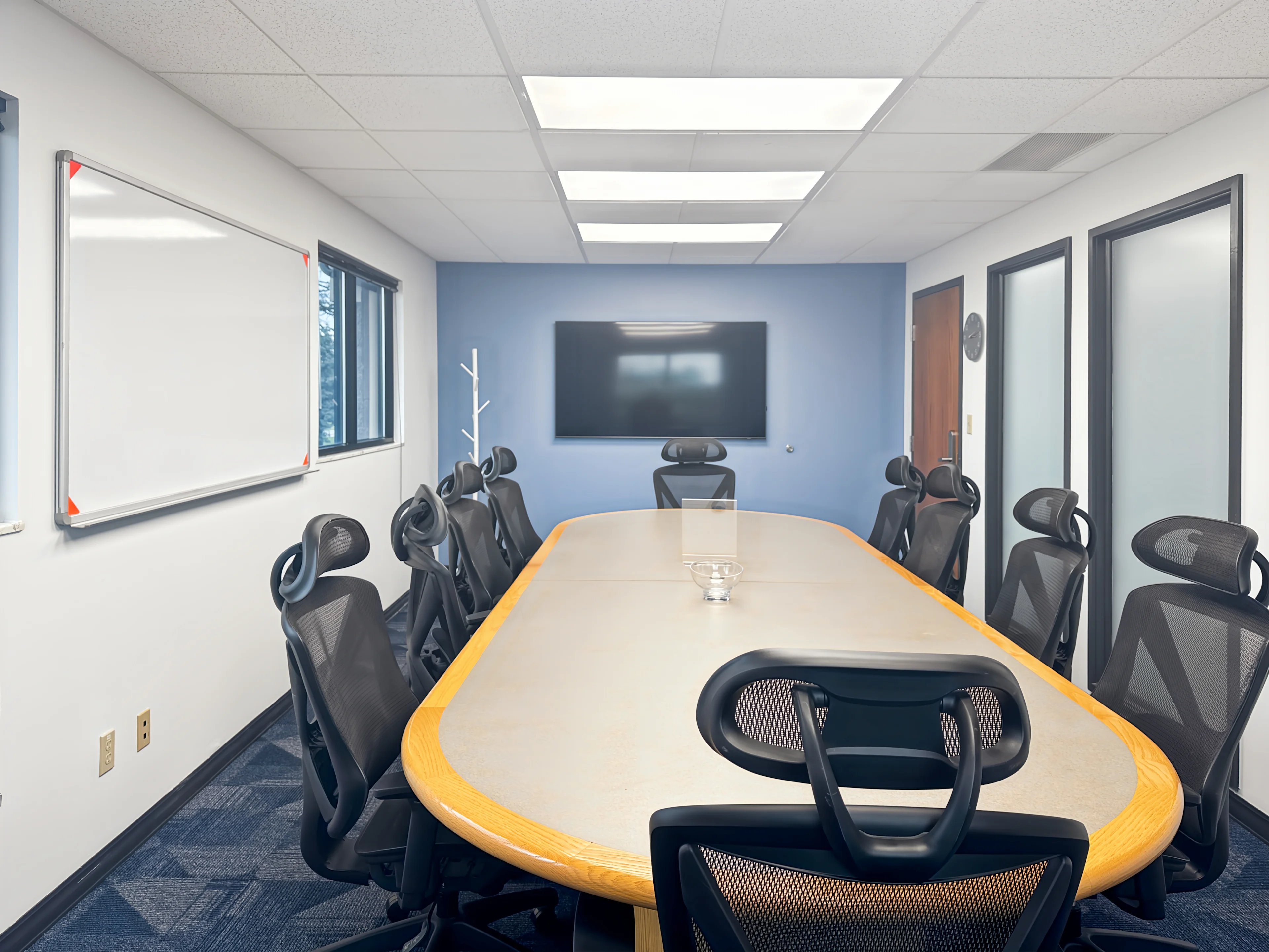 Modern fitted office interior with desks and collaborative workspace